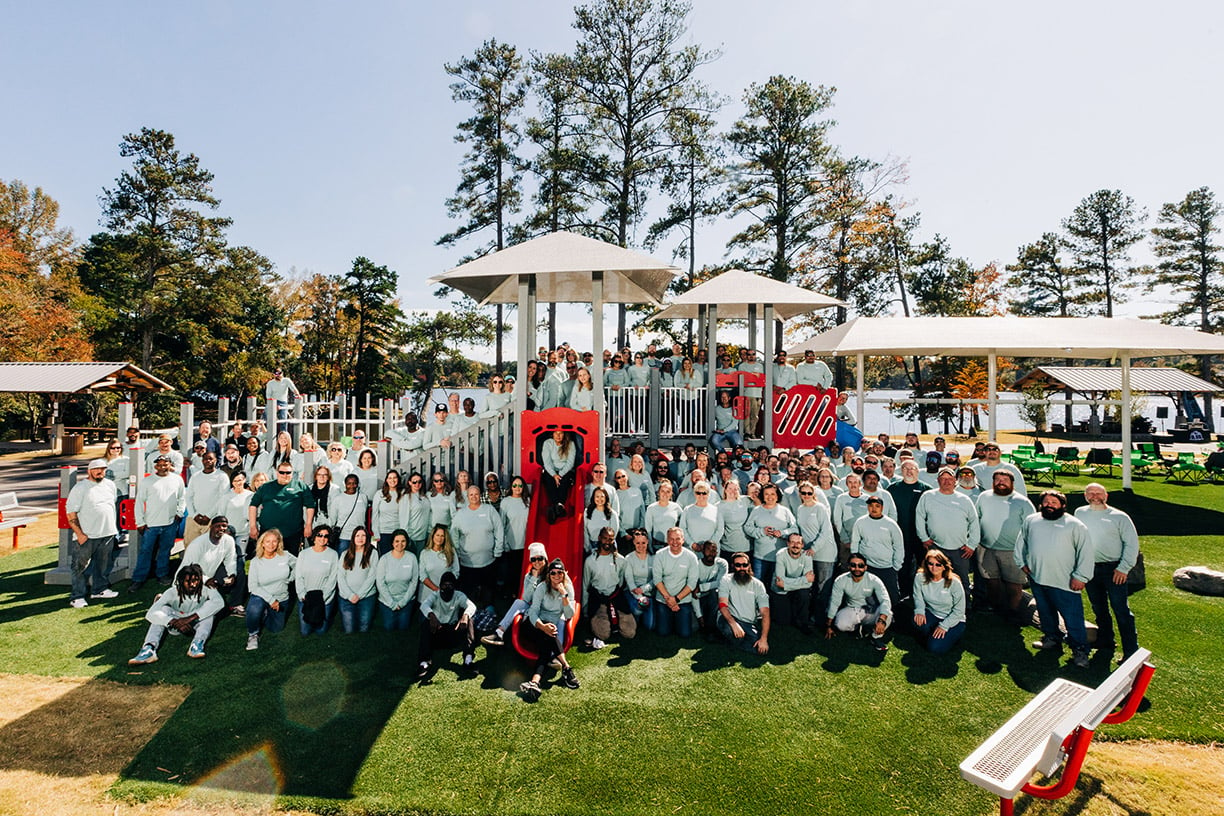 group photo of people on a playground