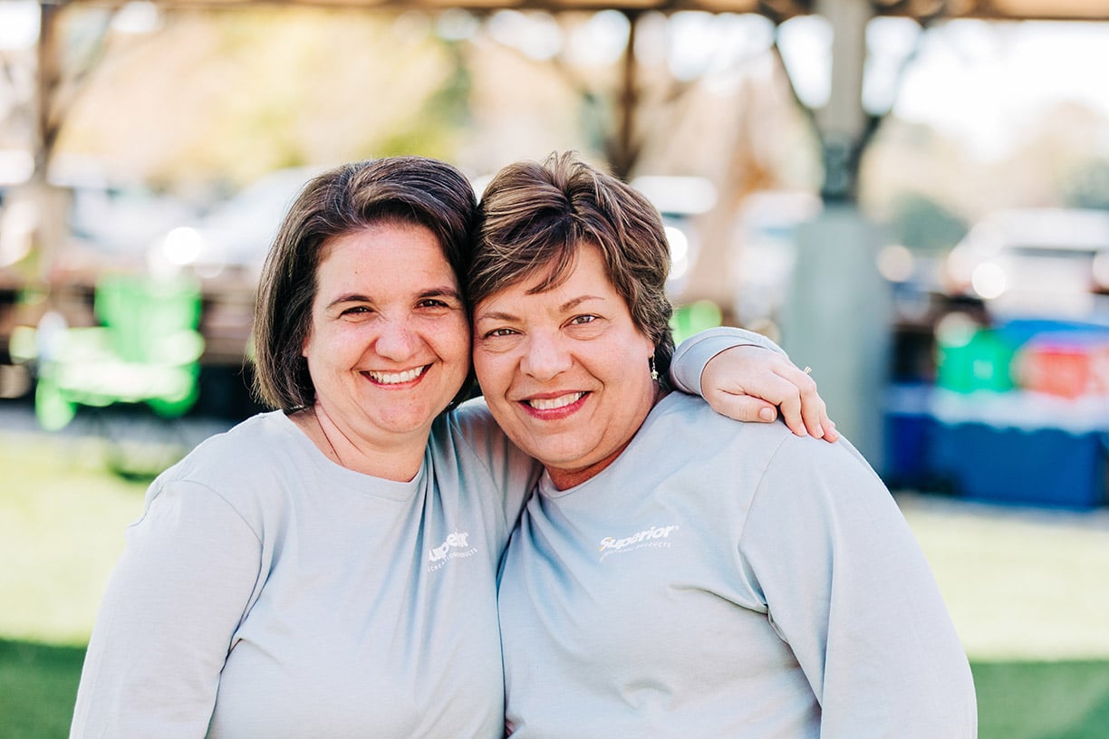 two women smiling for a picture